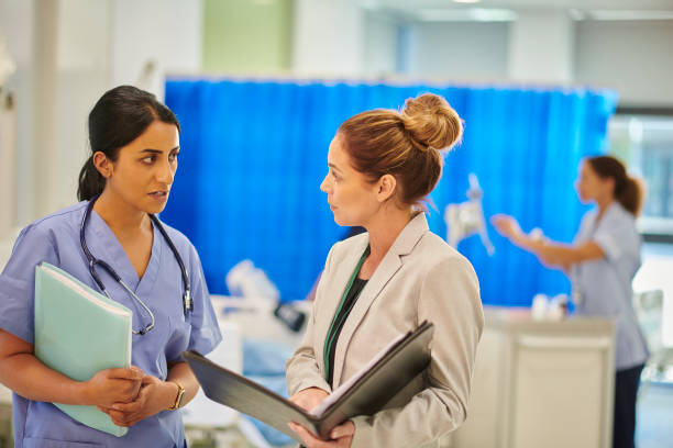 istock hospital consultant chatting to administrator 2163190621