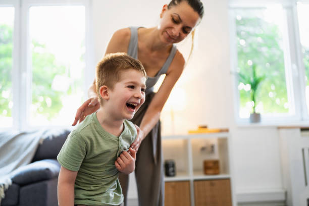 istock Mom fixing kid's bad posture 2163196985