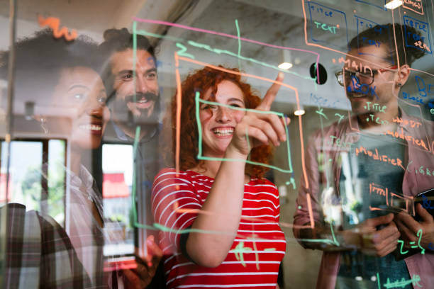 istock Team of programmers writing digital code in the metaverse and working together on the internet 2163197025