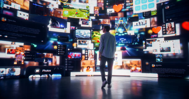 istock Backview Of Caucasian Man Looking at Animated Stream Of Content. Visualization Of Browsing Metaverse Big Data with Viral Videos, Social Media Profiles with Influencers, and Internet Communities. 2163201756