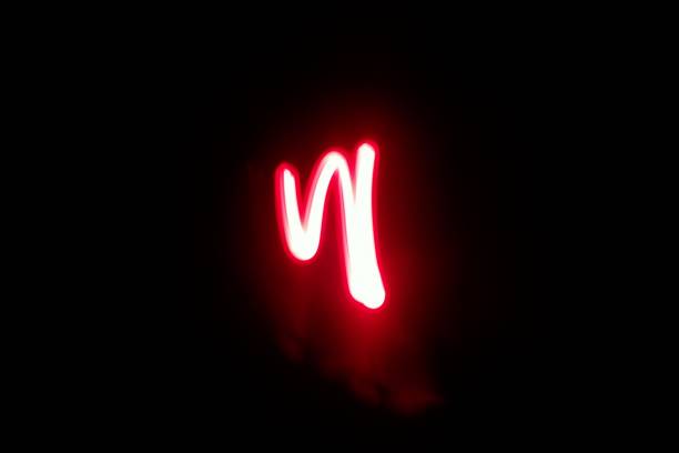 istock Blurred red neon lights.  Overlay of colored light.  Disco lighting.  Soft texture of unfocused red ultraviolet light on dark abstract empty space background 2163205464