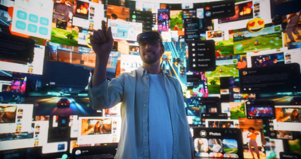 istock Portrait Of Caucasian Man Wearing Augmented Reality Glasses And Surfing Cyberspace Interface. Male Using Gestures To Browse Web Content, Watch Video Streaming, Social Media Influencers In AR. 2163209318