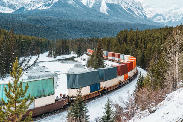 istock A freight train carrying container passing through the Bow Valley on winter at Morants Curve 2163210416