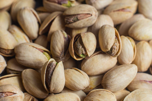 istock Salted pistachios close-up. Pistachios macro 2163211425