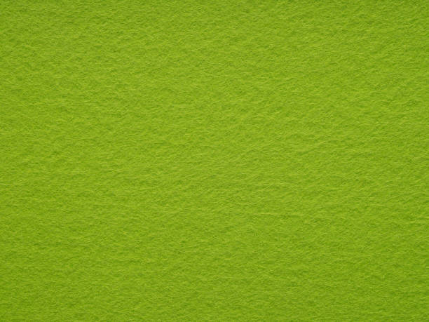 istock Bright or soft green felt, velvet texture. Background for text. 2163213023