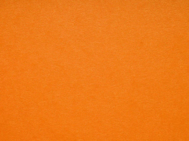 istock Metallized orange soft matt paper background. 2163213303