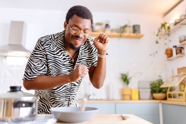 istock Man enjoying preparing food in the kitchen 2163215926