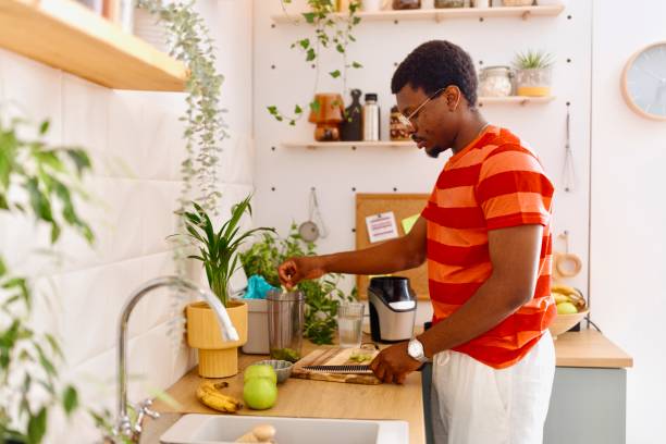 istock Young man preparing a healthy smoothie 2163216528