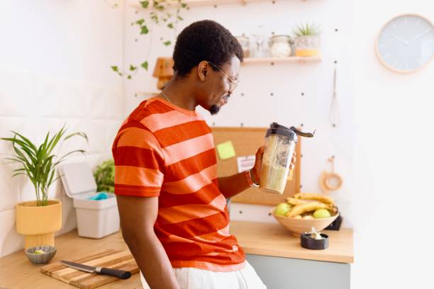 istock Proud man drinking a healthy smoothie for breakfast 2163216587