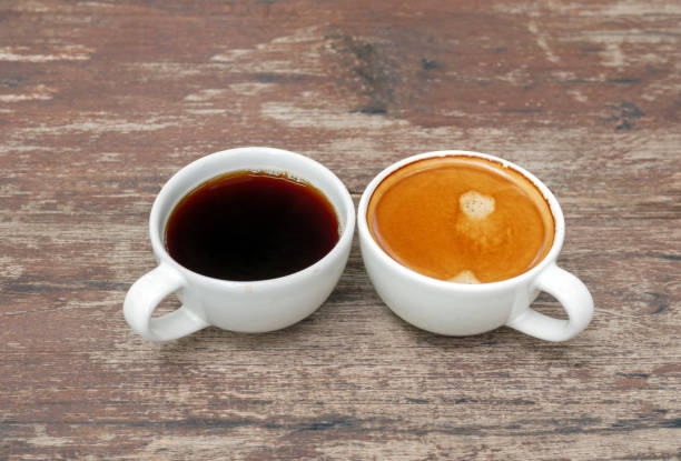 istock Two coffee cup, Americano coffee and espresso coffee on wooden table 2163217867