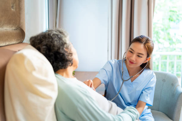 istock Doctor examine senior patient at home. 2163218535