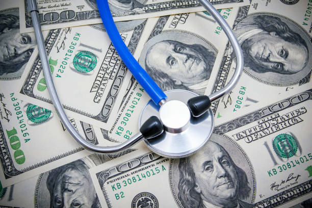 Stethoscope on US Paper Currency background.