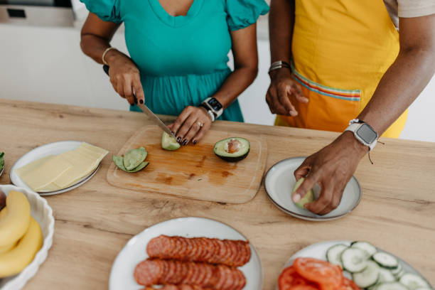 istock Couple preparing avocado slices for a healthy meal 2163219418