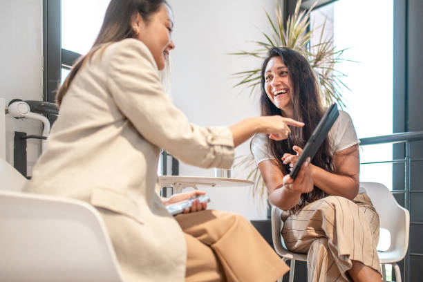 istock Diverse Female Executives Collaborating in Modern Office 2163222333
