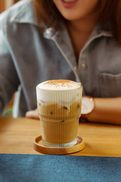 istock Elegant layered cappuccino on wood; a refined sip 2163223086