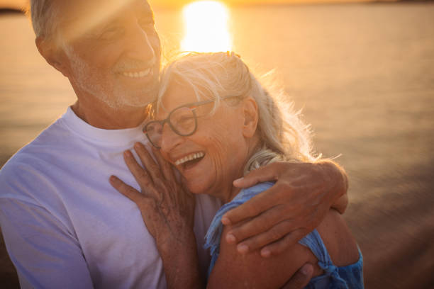istock Loving senior couple's tender moment by the seaside 2163224248