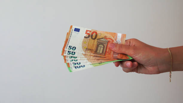 istock Hand Showing Euro Banknotes 2163225293