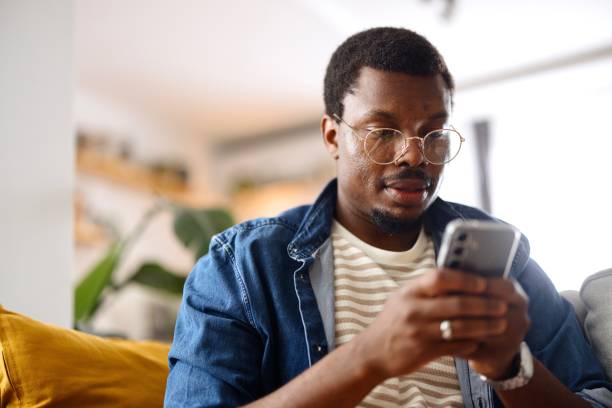 istock Close-up of a man surfing the net 2163225504