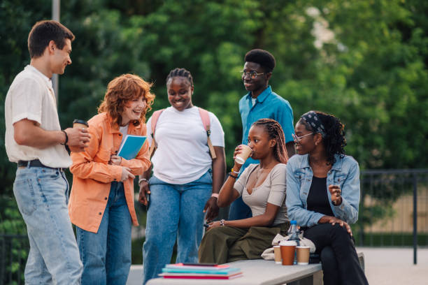 istock Group of diverse college students taking a break at university campus. 2163226003