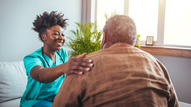 istock Caring Nurse with Senior Patient at Home 2163227214