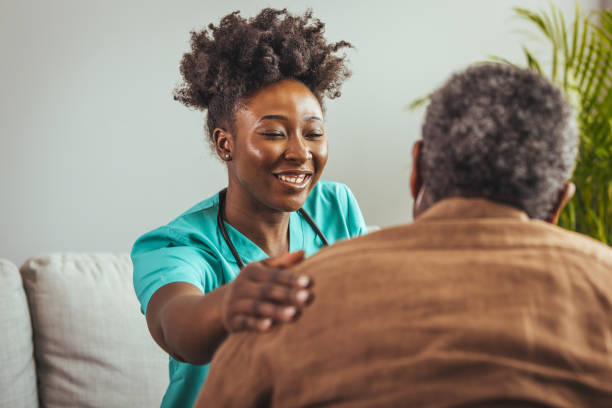 istock Caring Nurse with Elderly Patient at Home 2163227307