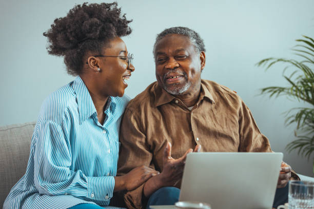 istock Smiling Black Father and Daughter Enjoying Video Call 2163227353