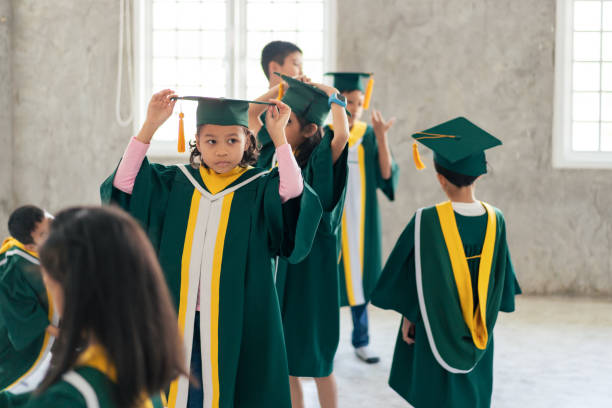 istock Childhood students and friends with graduation 2163227481