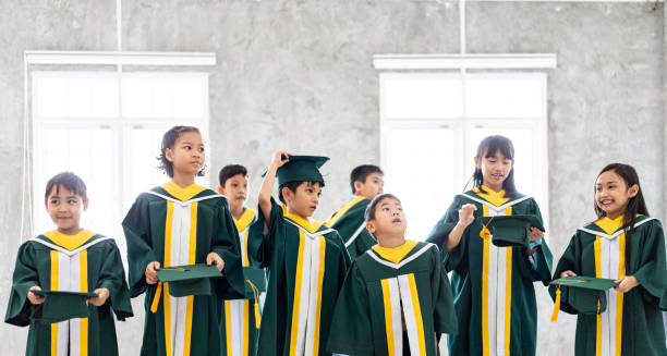 istock Childhood students and friends with graduation 2163227501