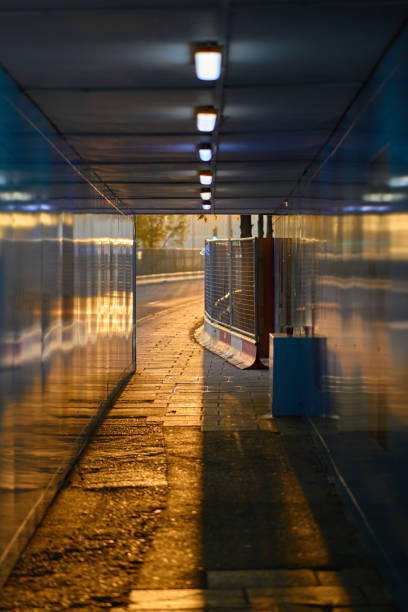 Contruction Pedestrian tunnel walkway  bathed in golden sunset light