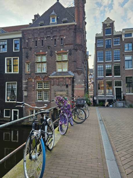istock Amsterdam Canal Bridge bicycle parking Holland Netherlands 2163242239