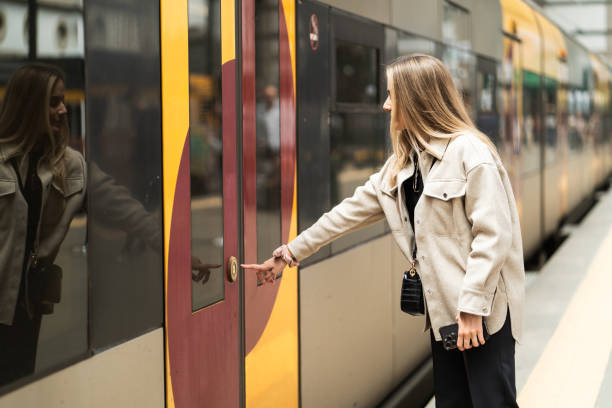 istock The woman is about to get on the train. 2163245491