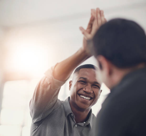 istock High five, smile and support with business people in office together for celebration, motivation or success. Bonus, goals or target with man employee friends in workplace for congratulations or deal 2163247263