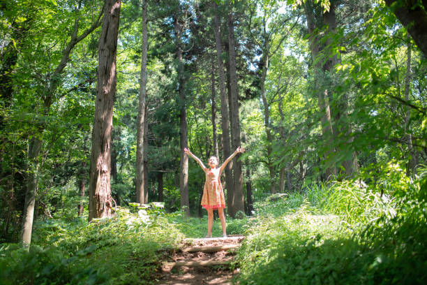 istock Girl open arms in the forest 2163250532