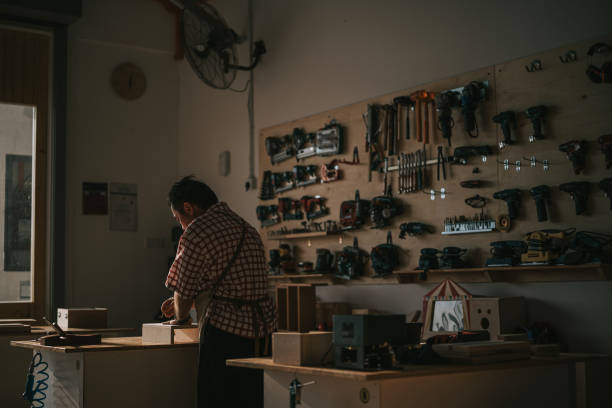 istock asian chinese senior carpenter working in woodshop workshop 2163250633