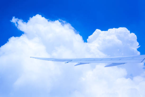 The view from inside an airplane flying in a beautiful blue sky