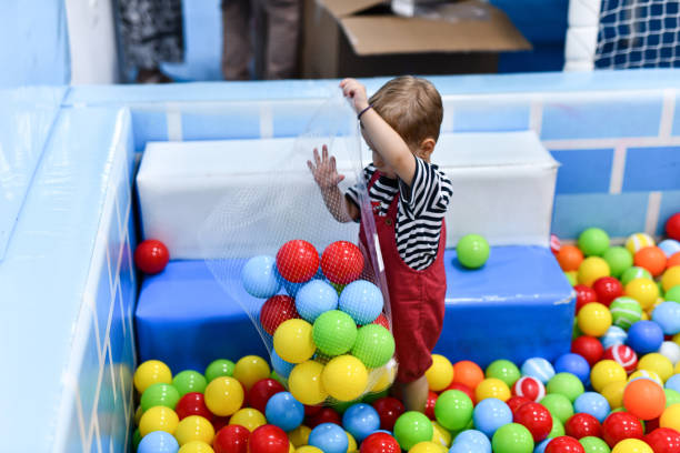 Toddler Playing In Ball Pool