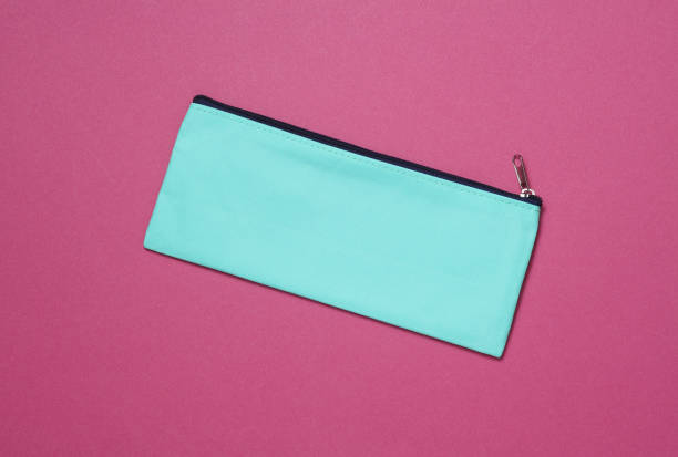 Blue school pencil case on a pink background