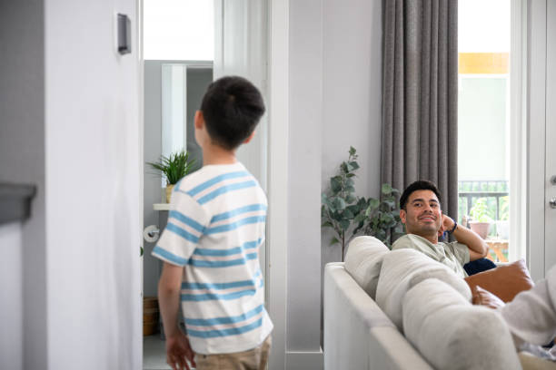 istock Boy asking father if he can adjust thermostat 2163255669