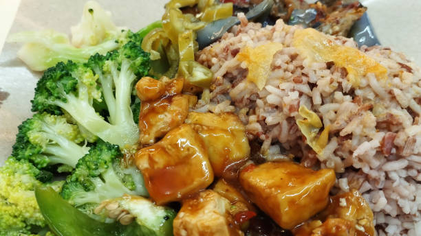 istock mixed vegetarian cuisine with brown rice and green chilies 2163255980