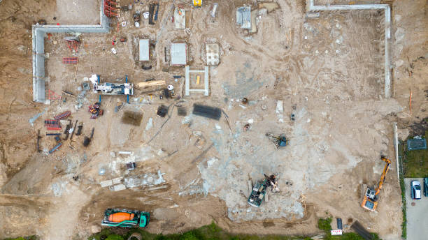 istock Drone photography of construction site , construction material and machinery during summer evening 2163260303