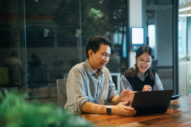 business persons working in a modern green office