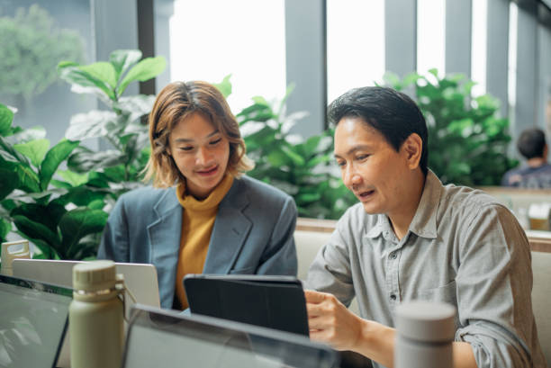 istock Group of business people working together in modern office working space 2163264110