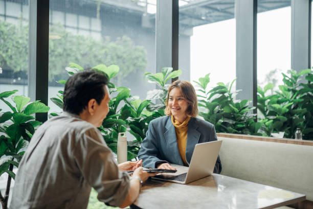 business persons working in a modern green office