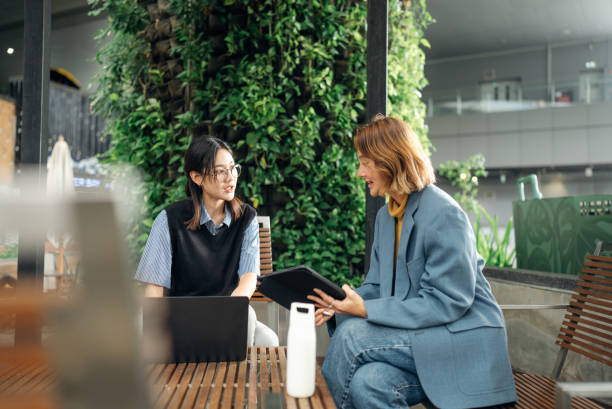 business persons working in a modern green office