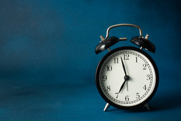 istock Black retro alarm clock closeup. Copy space. 2163266739