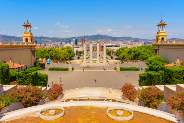 Barcelona, Spain - July 16, 2024: Breathtaking view captured from steps of Palau Nacional overlooking vibrant city of Barcelona on a sunny summer day