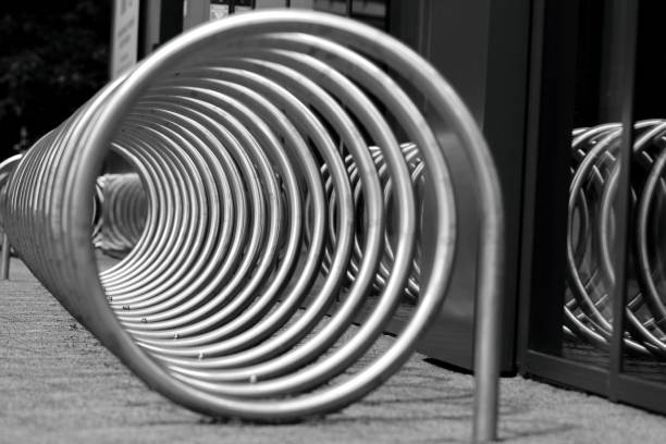 Abstract tubular structure of a coiled spiral as a bicycle rack.