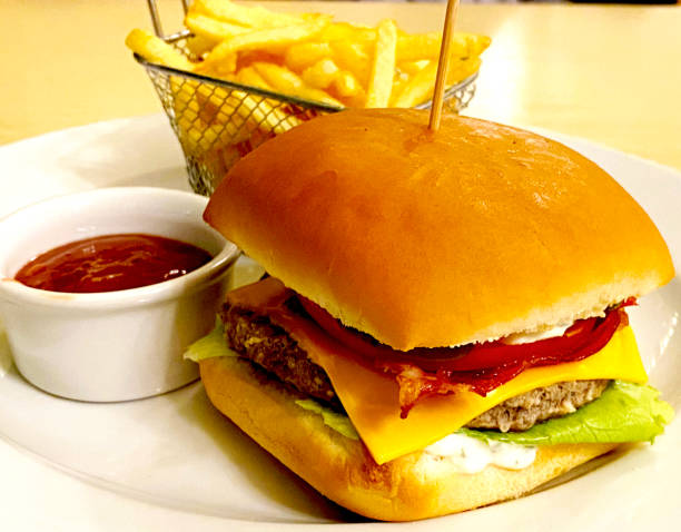 istock burger with meat and fries with sauce 2163276492