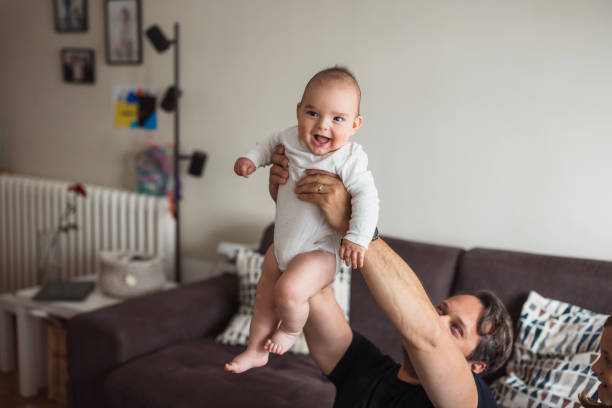 Man holding a happy baby