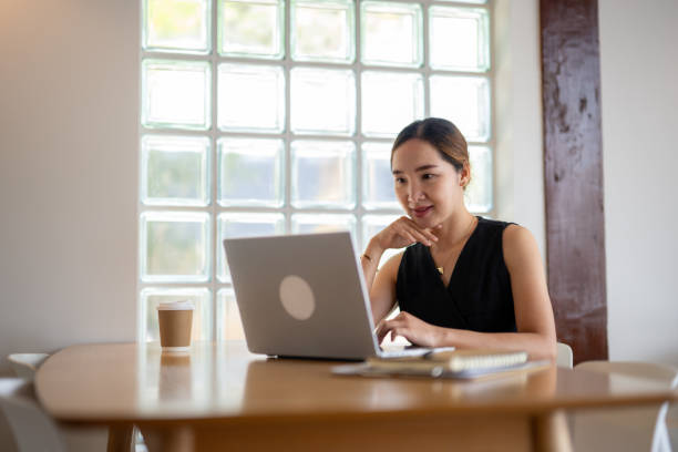 istock Focused Entrepreneur Working on Laptop with Coffee 2163277876
